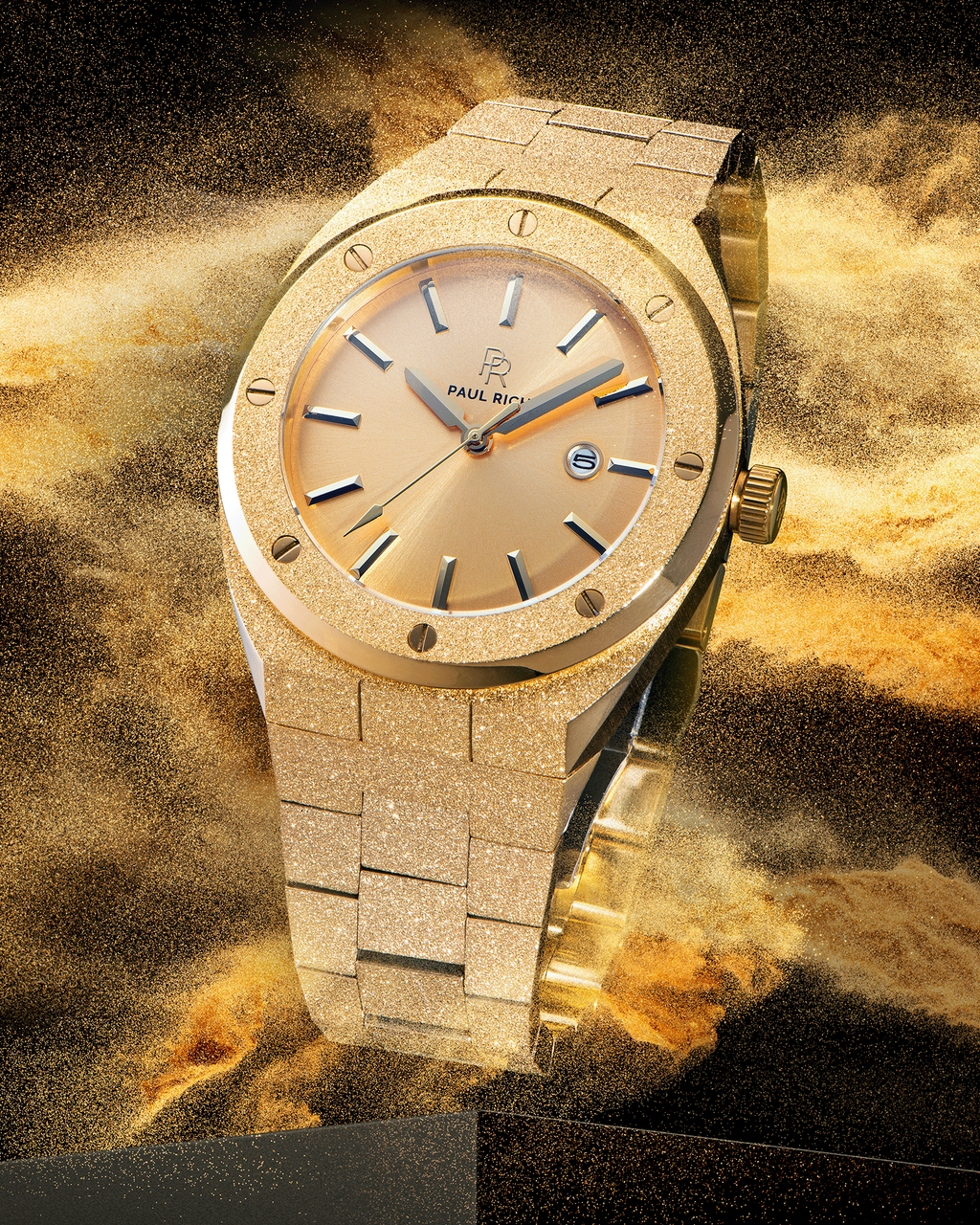 Paul Rich watch with frosted gold case and bracelet, metallic champagne gold sunray dial, and date window, shown in golden sandburst explosion on black.