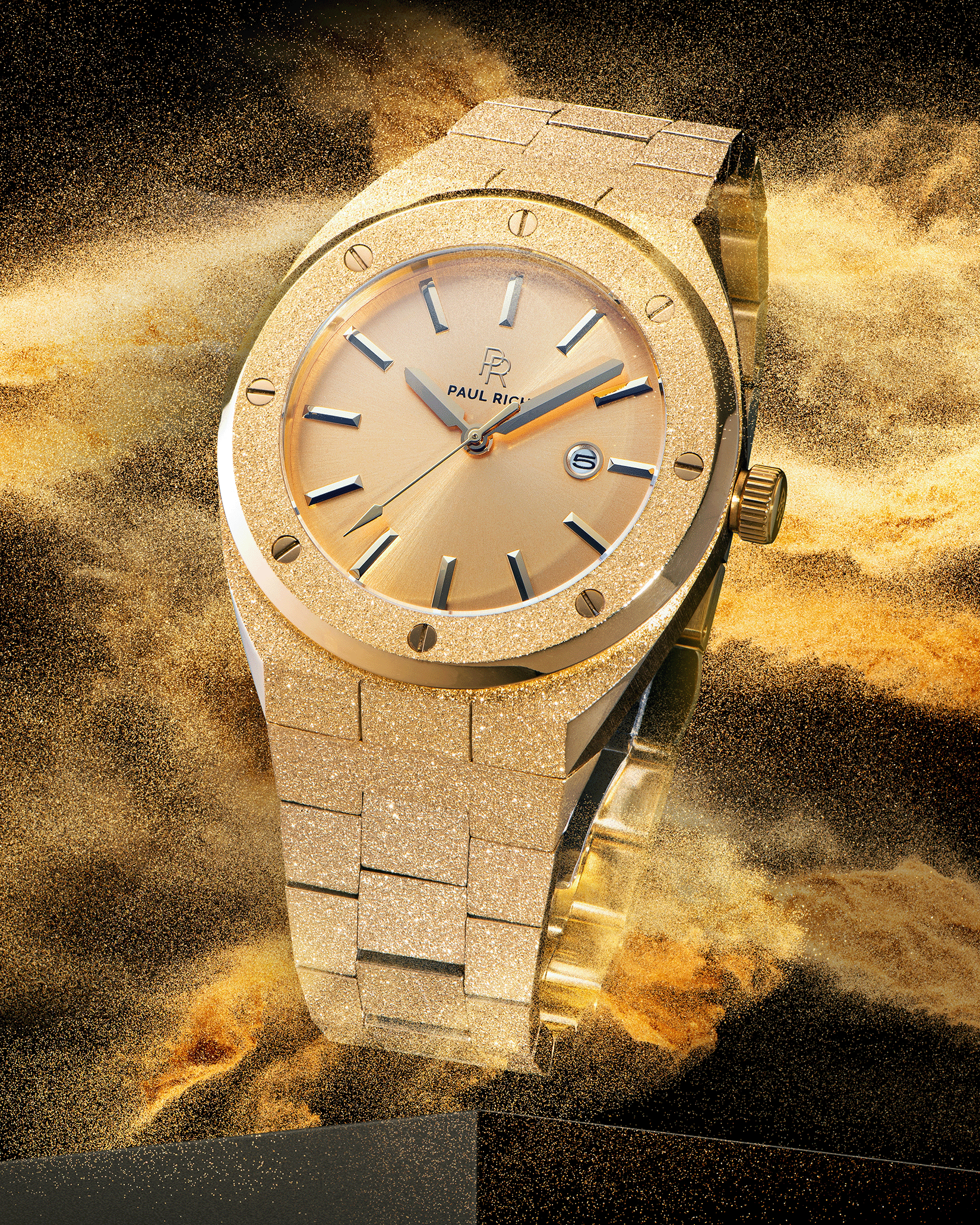 Paul Rich watch with frosted gold case and bracelet, metallic champagne gold sunray dial, and date window, shown in golden sandburst explosion on black.