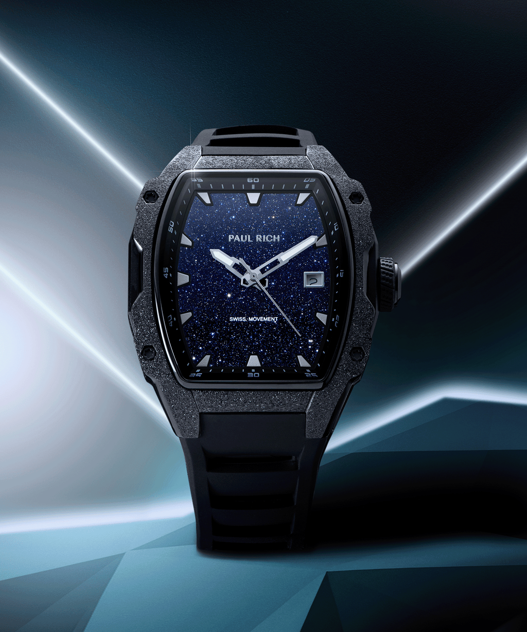 Tonneau-shaped Paul Rich watch with blue aventurine dial and black frosted bezel displayed in futuristic neon geometric setting.