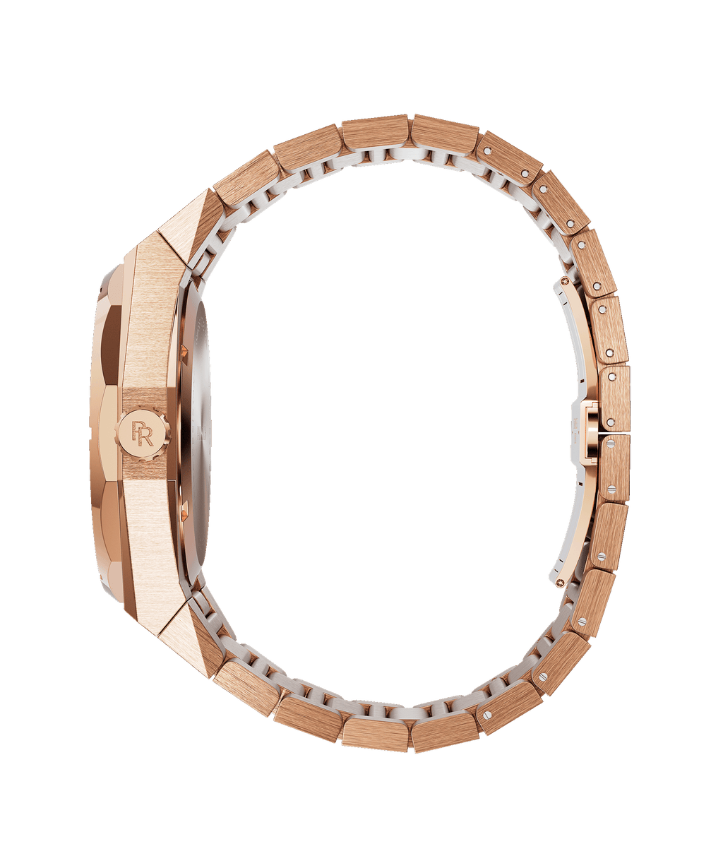 Side view of a rose gold Paul Rich watch with a fully frosted case (frosting not visible from this angle), engraved crown, and fully closed rose gold link bracelet, displayed in a circular position.