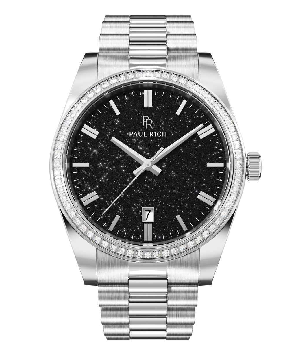 Silver wristwatch with a black aventurine dial, crystal-set bezel, silver hour markers, and metal bracelet shown on a transparent background.