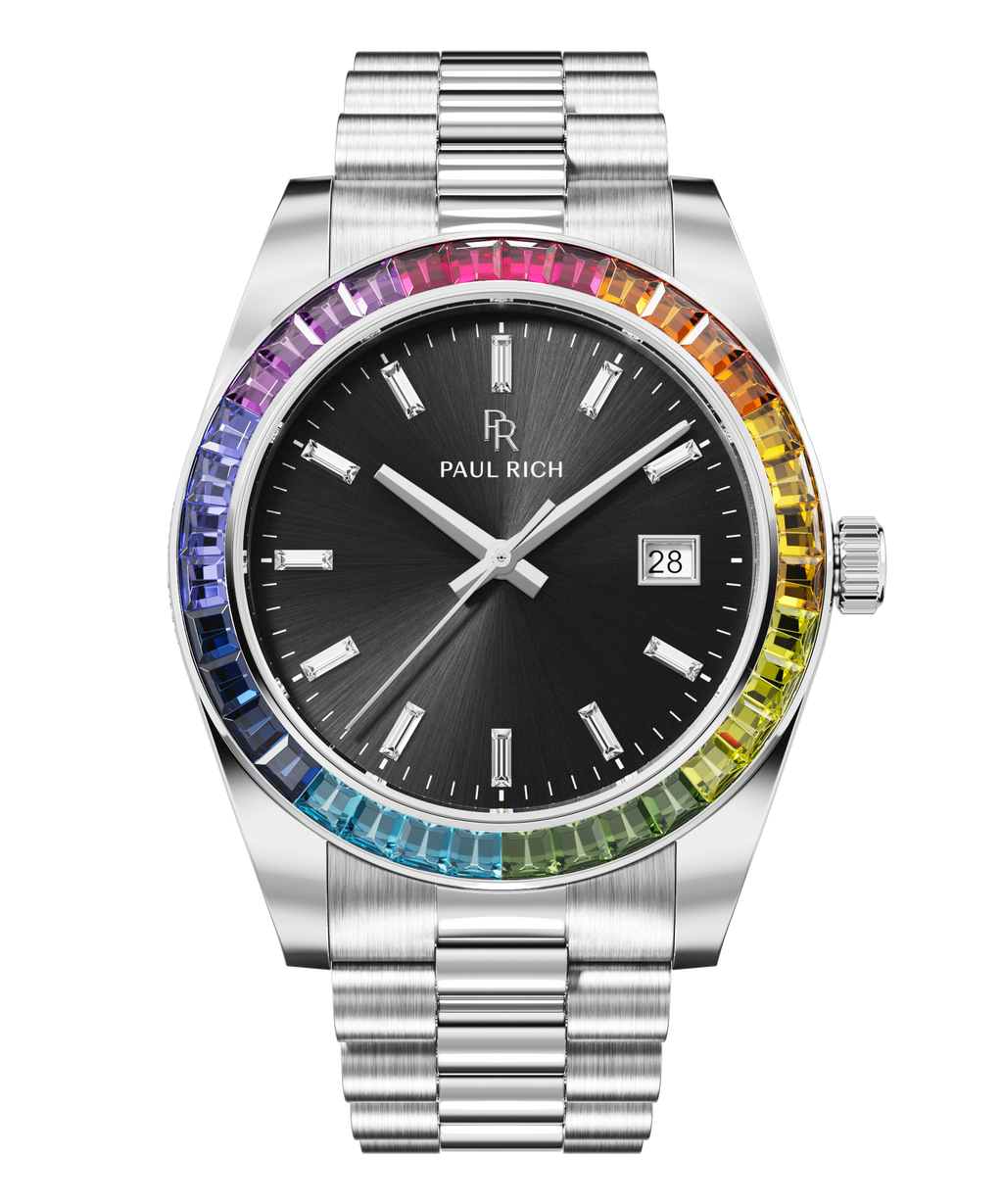 Silver wristwatch with a black sunburst dial, baguette hour markers, and a rainbow bezel shown on a transparent background.
