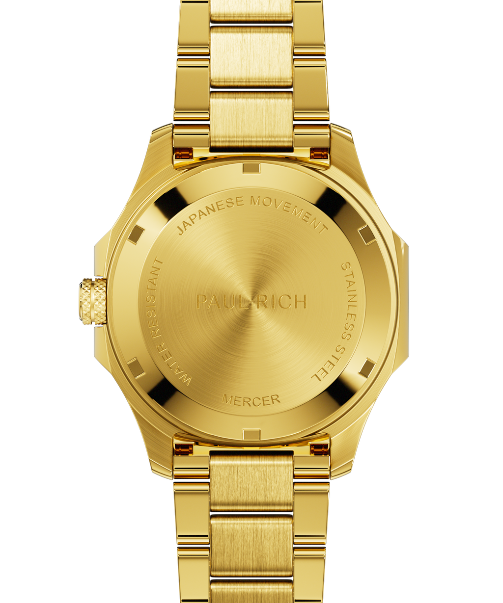 Back view of Paul Rich watch with brushed gold caseback engraved with “PAUL RICH,” “MERCER,” “JAPANESE MOVEMENT,” and “STAINLESS STEEL.”
