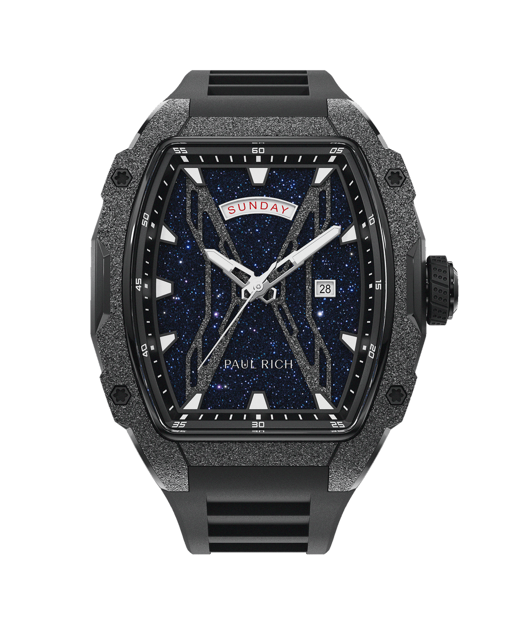 Front view of Paul Rich watch with blue aventurine dial, day and date display, frosted case, and black rubber strap.