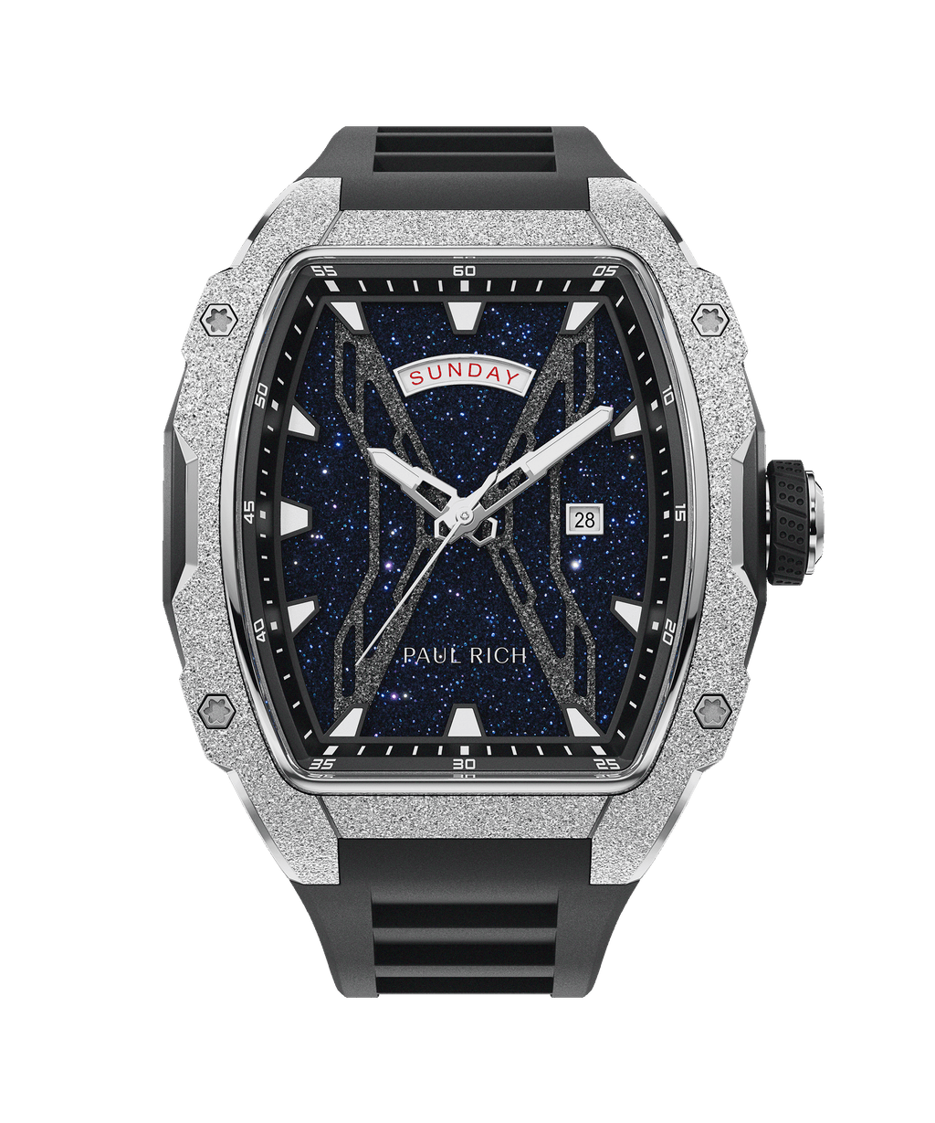 Front view of Paul Rich watch with blue aventurine dial, silver frosted bezel, day and date display, and black rubber strap.