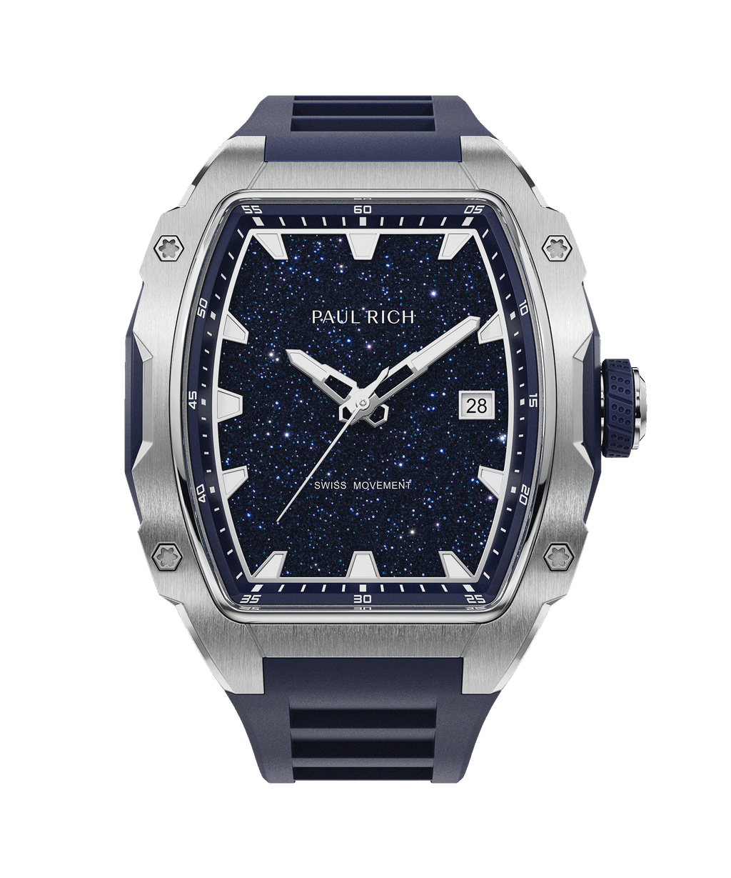 Front view of a Paul Rich silver-tonneau watch with blue aventurine dial, silver hands, date window, and blue rubber strap.