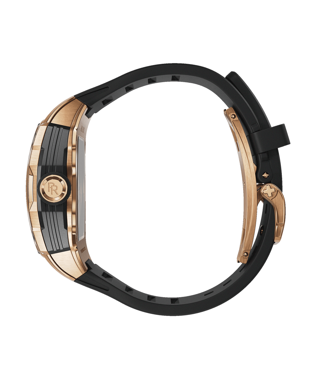 Side view of Paul Rich watch with rose gold PR monogram crown, brushed rose gold case, and curved black rubber strap with matching clasp.