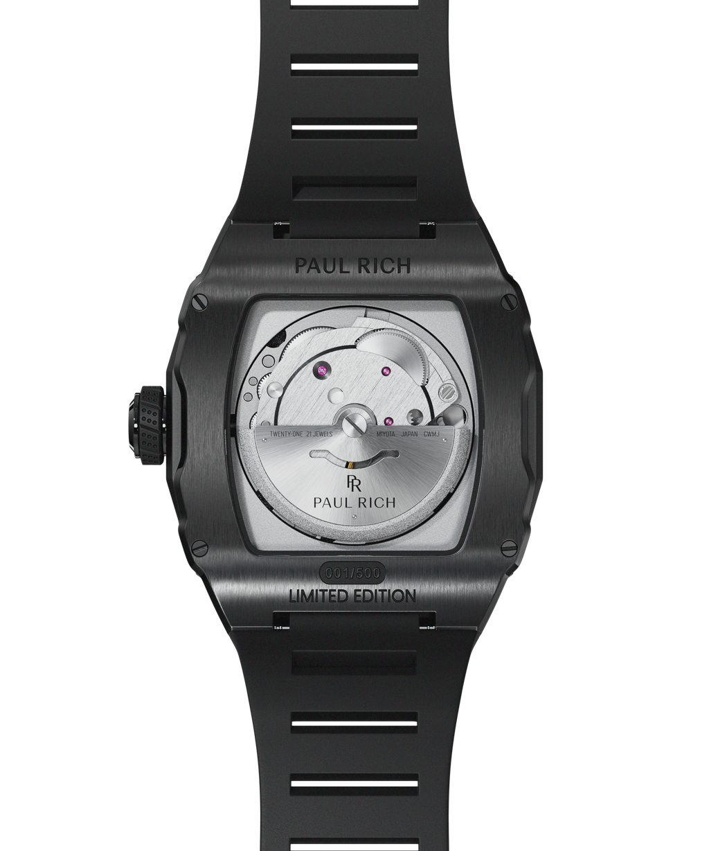 Back view of Paul Rich Astro Meteora with open caseback showing Miyota movement, black brushed case, and black rubber strap, limited edition.