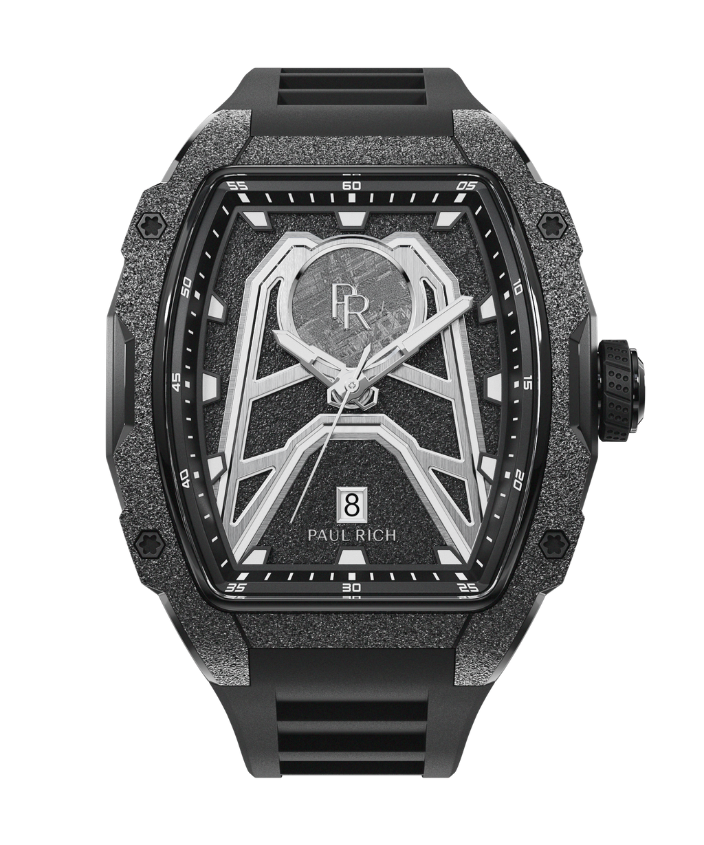 Paul Rich Astro Meteora watch with meteorite inlay, frosted black bezel, black dial details, and black rubber strap with date window at 6.
