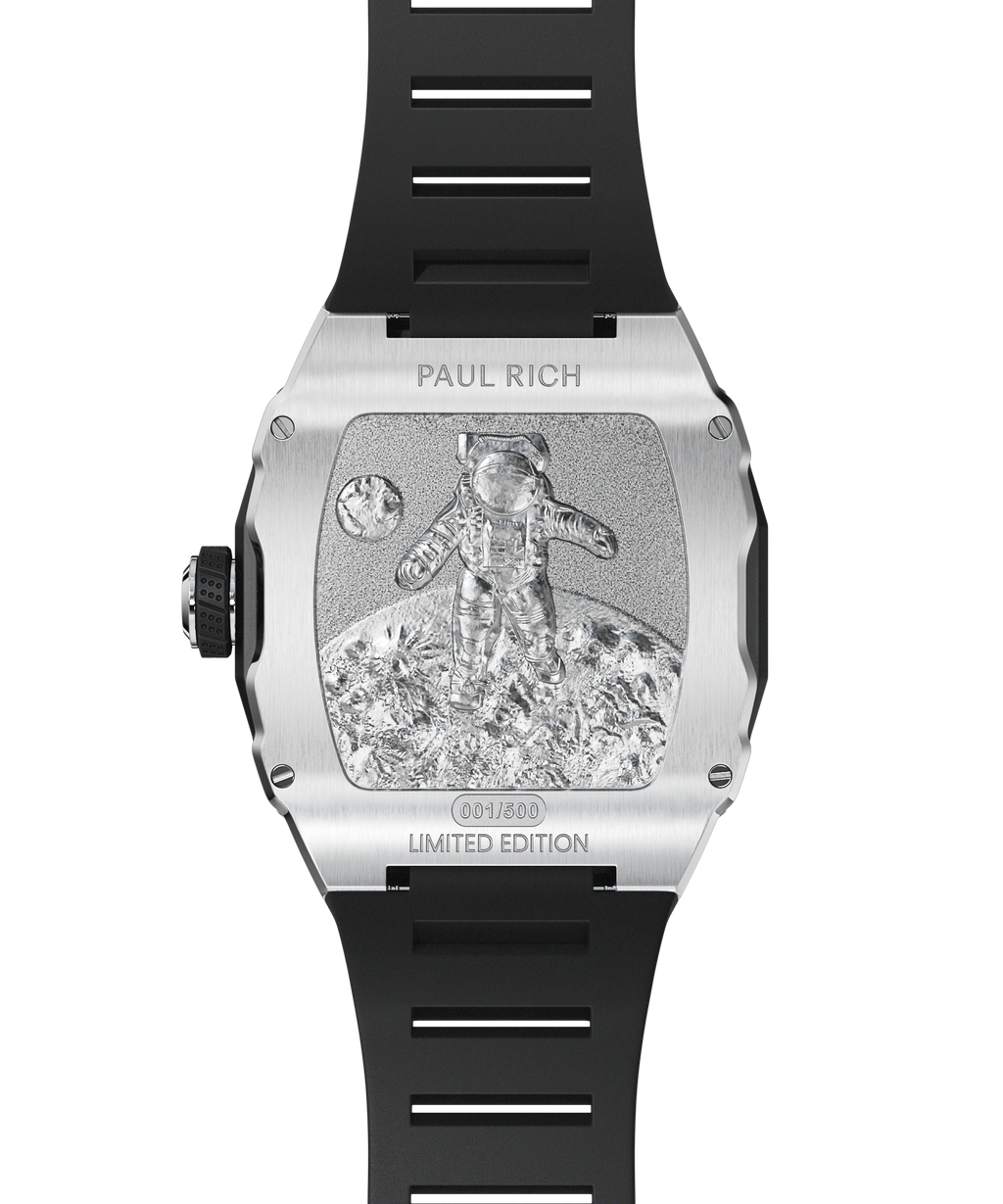 Engraved caseback of Paul Rich Astro Meteora in silver, showing astronaut on lunar surface with limited edition marking and black rubber strap.