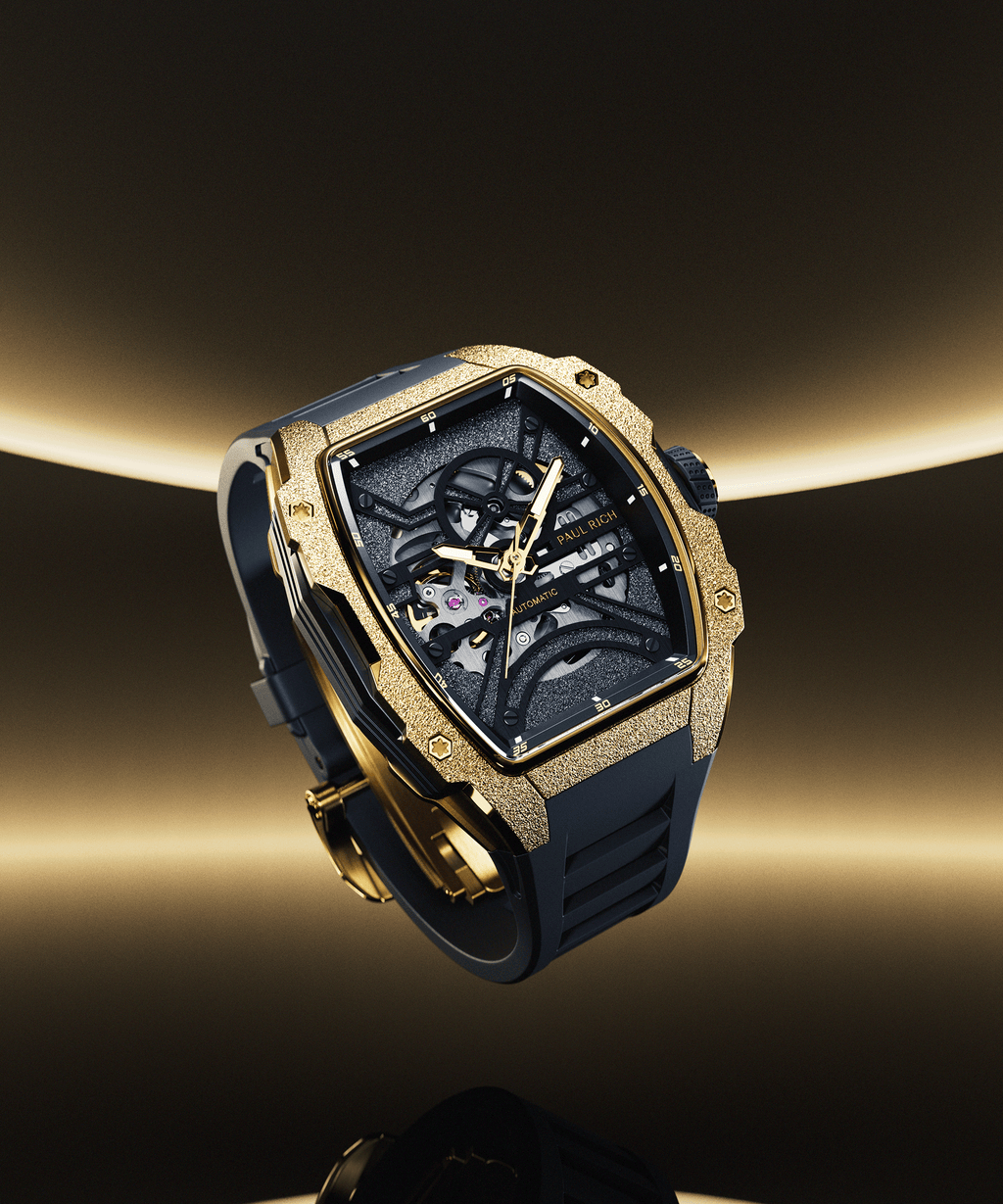 Paul Rich watch with frosted gold tonneau case, skeleton dial, and black strap, shown floating against a dark gold gradient background.