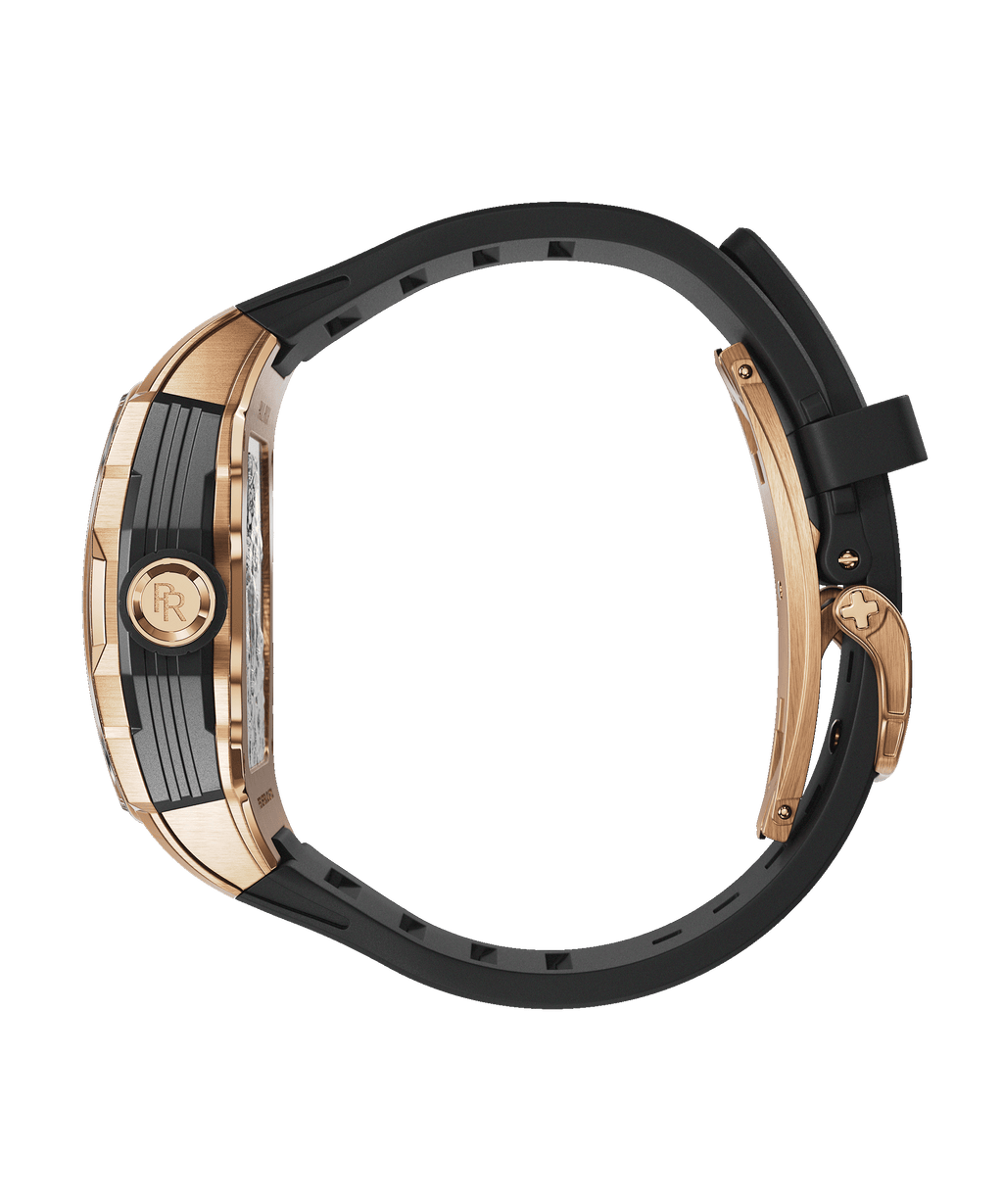 Side view of Paul Rich watch with rose gold and black case, black rubber strap, and engraved crown featuring the PR monogram.