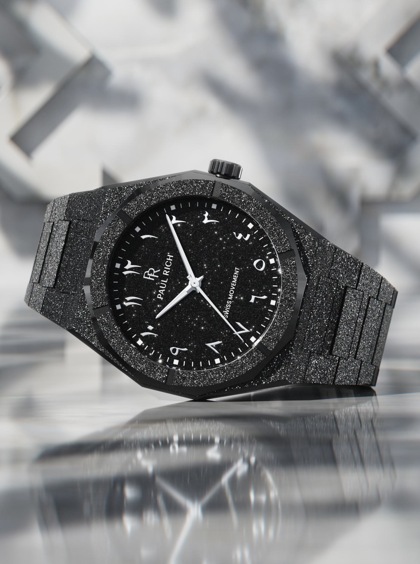 Paul Rich black frosted watch with black aventurine dial, silver Eastern Arabic numerals, and Swiss movement on black bracelet.






