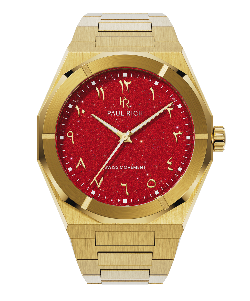 Paul Rich watch with brushed gold case and bracelet, featuring a red aventurine dial with Arabic numerals and gold hands.