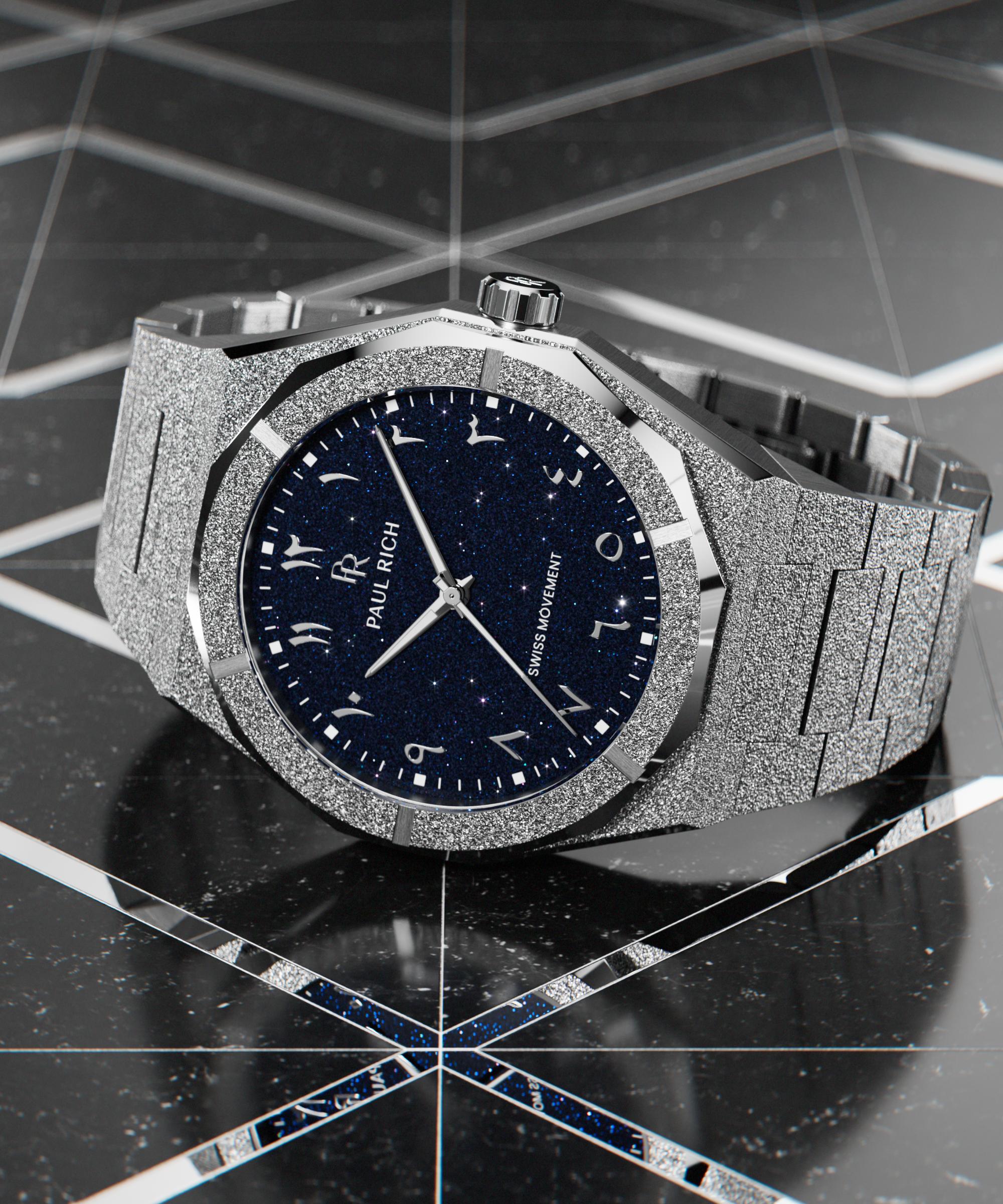 Frosted silver watch with a blue aventurine dial and Arabic numerals, displayed on a glossy black geometric surface with mirrored accents.