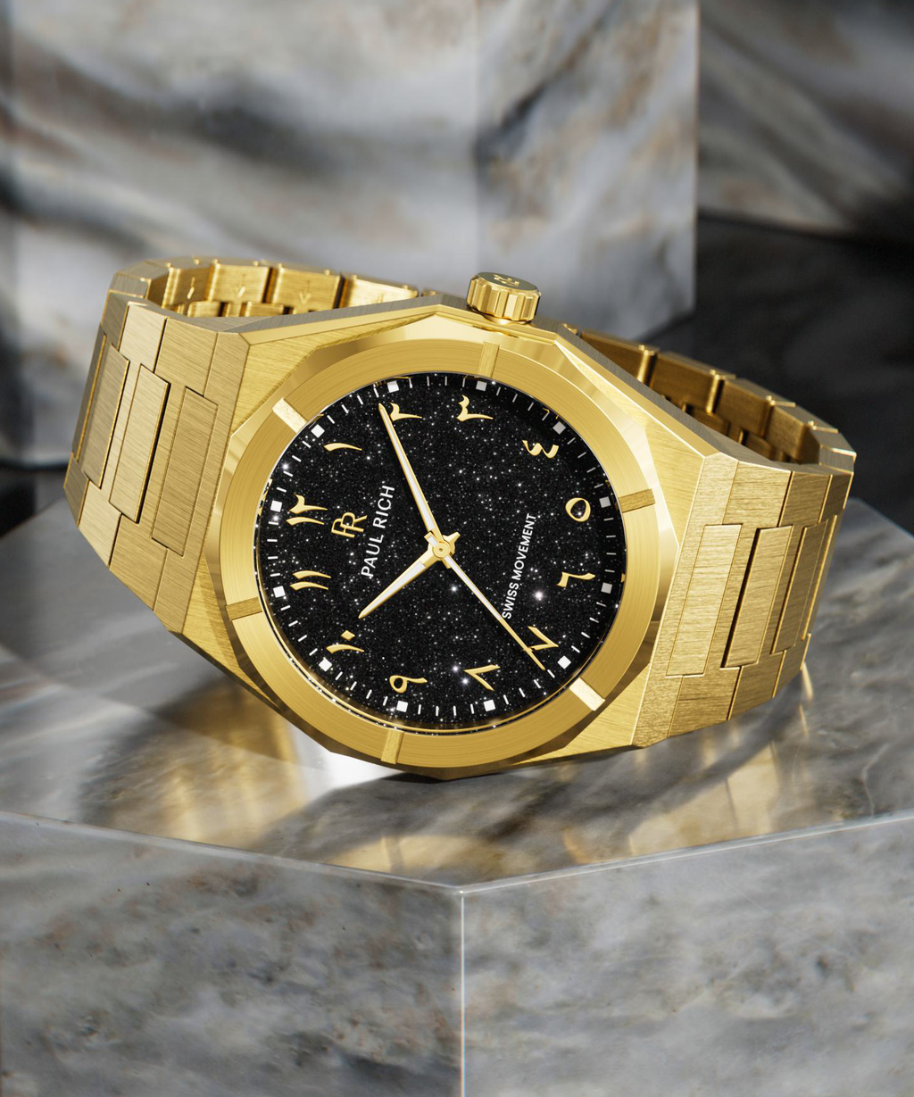 Paul Rich gold brushed watch with black aventurine dial, gold Eastern Arabic numerals, and Swiss movement on gold bracelet.