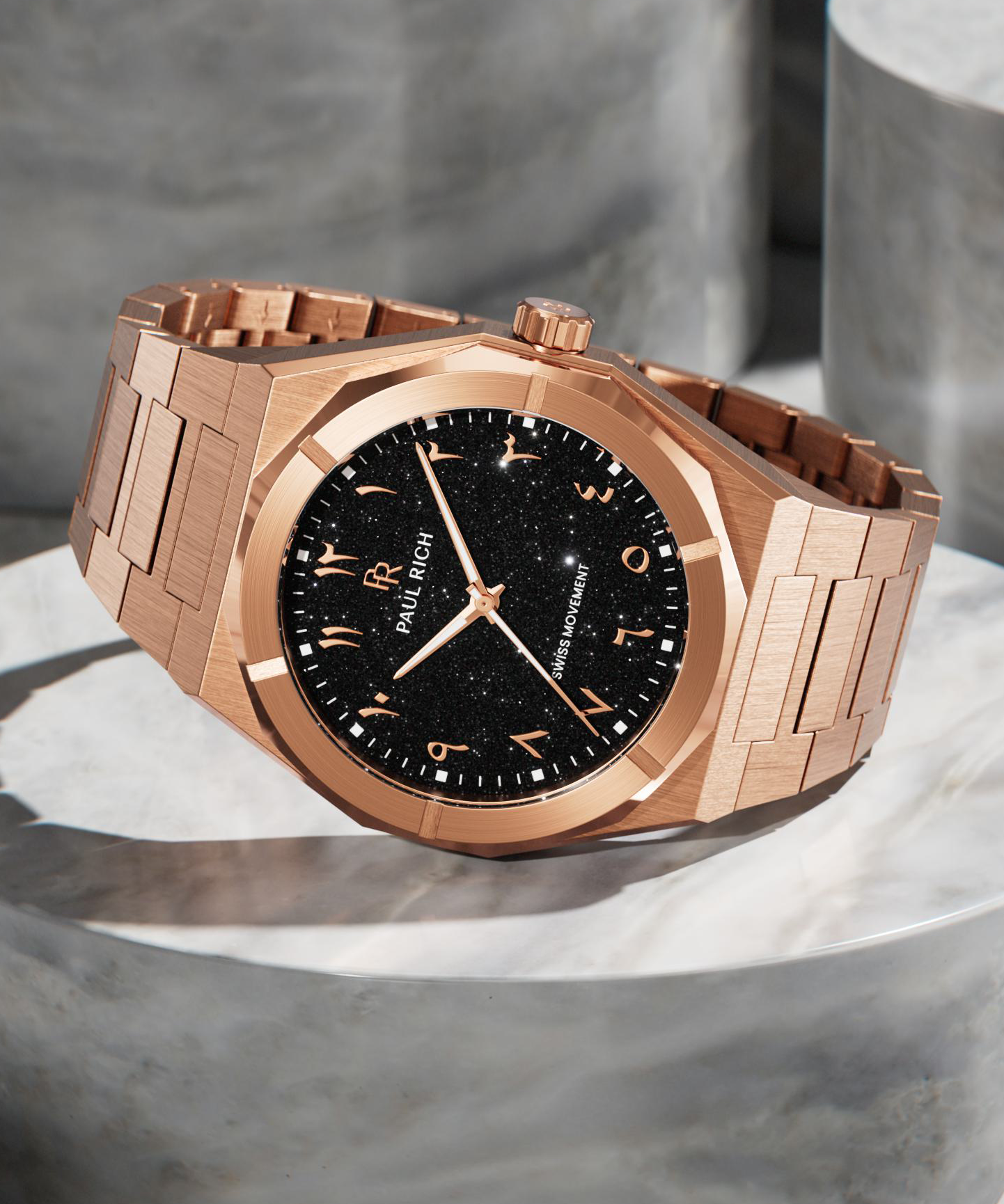 Paul Rich rose gold watch with black aventurine dial and Arabic numerals, displayed on polished stone, featuring Swiss movement.