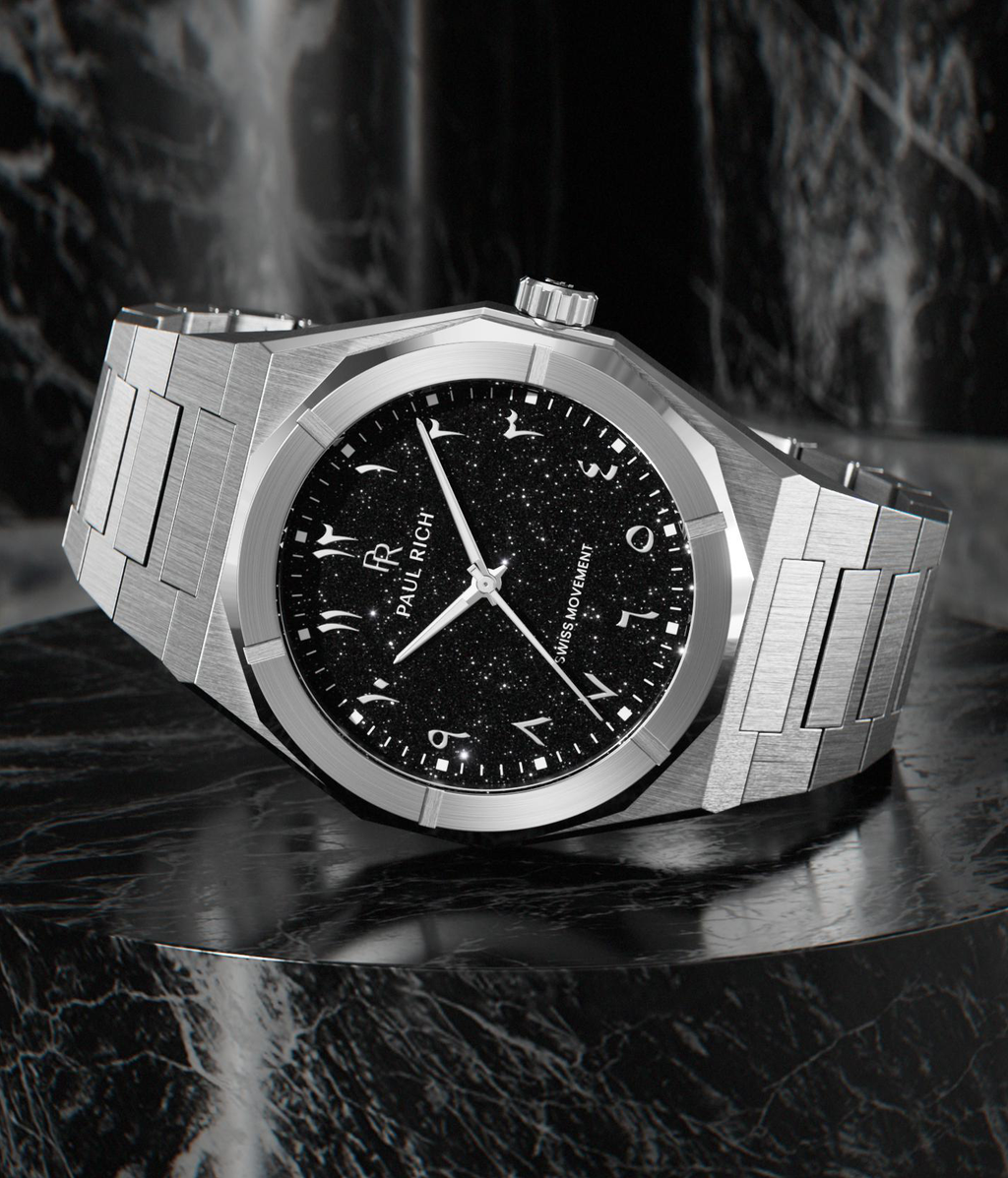 Paul Rich brushed steel watch with black aventurine dial, silver Eastern Arabic numerals, and Swiss movement on steel bracelet.
