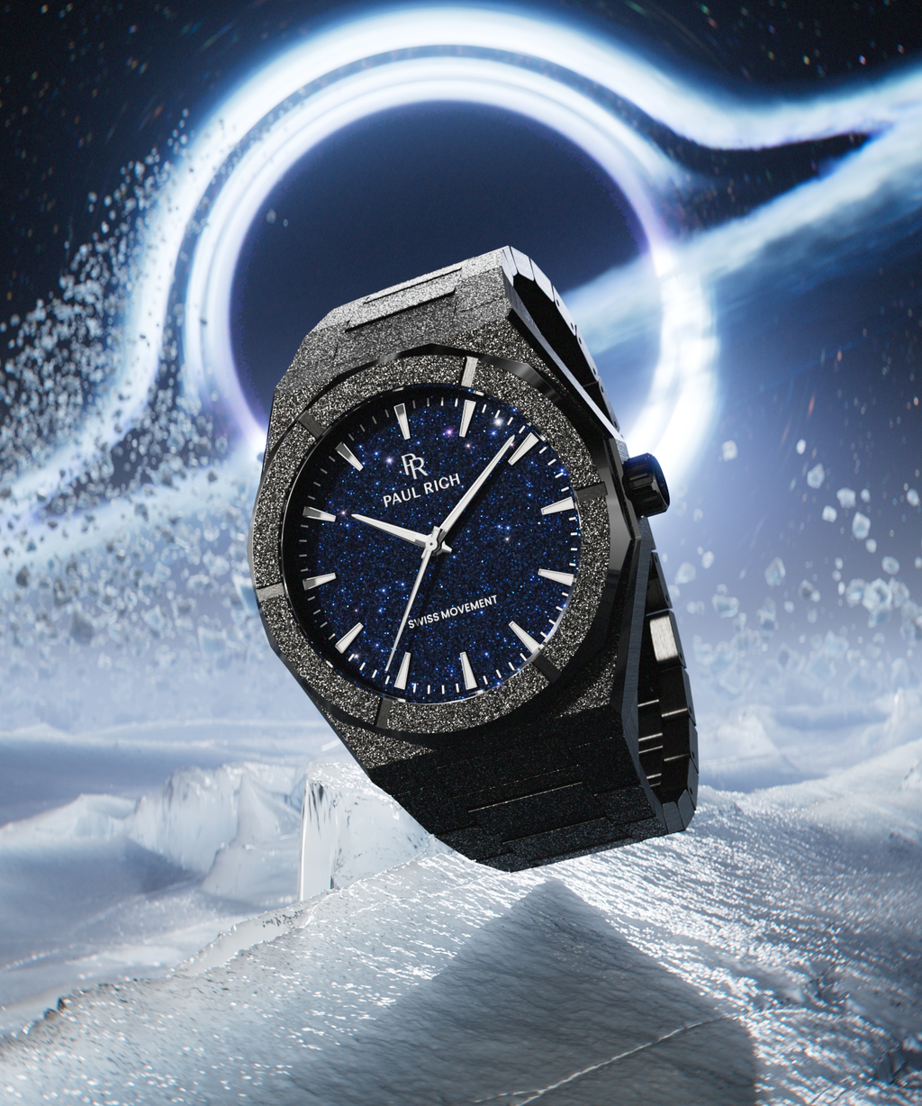 Black frosted Paul Rich watch with blue aventurine dial floating on icy terrain, with a glowing black hole and debris in the background.