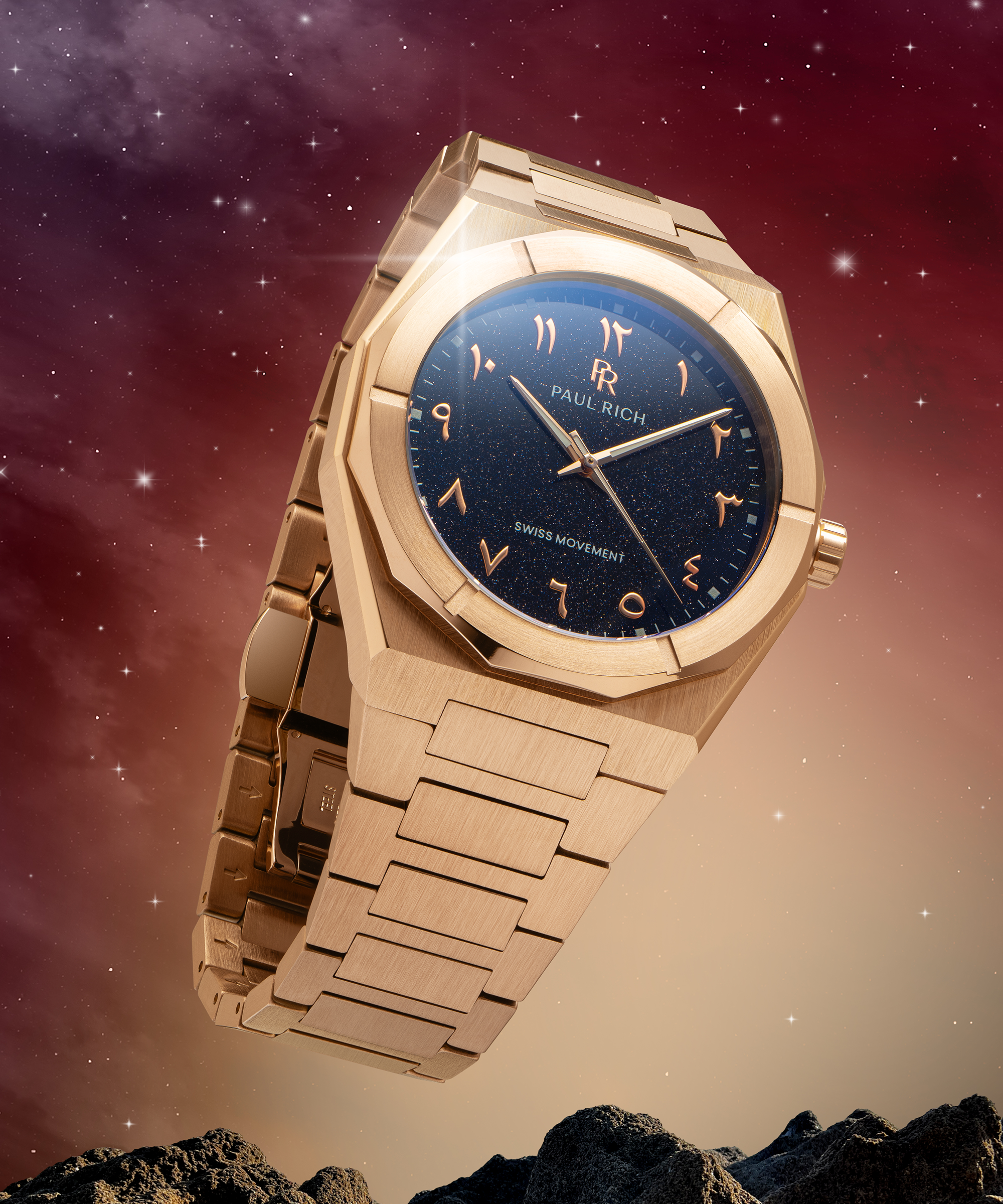 Paul Rich watch with brushed rose gold case and blue aventurine dial with Arabic numerals, displayed in a cosmic setting with stars and rocks.