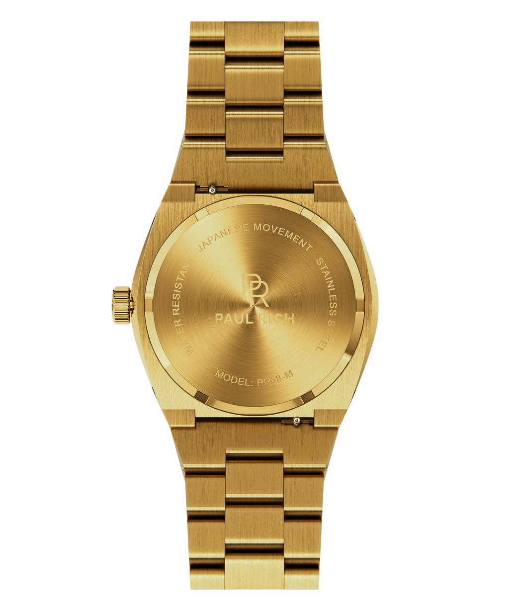 Back of Paul Rich watch with brushed gold stainless steel case and bracelet, showing engraved PR logo and text including “MODEL: PR68-M” and “JAPANESE MOVEMENT.”