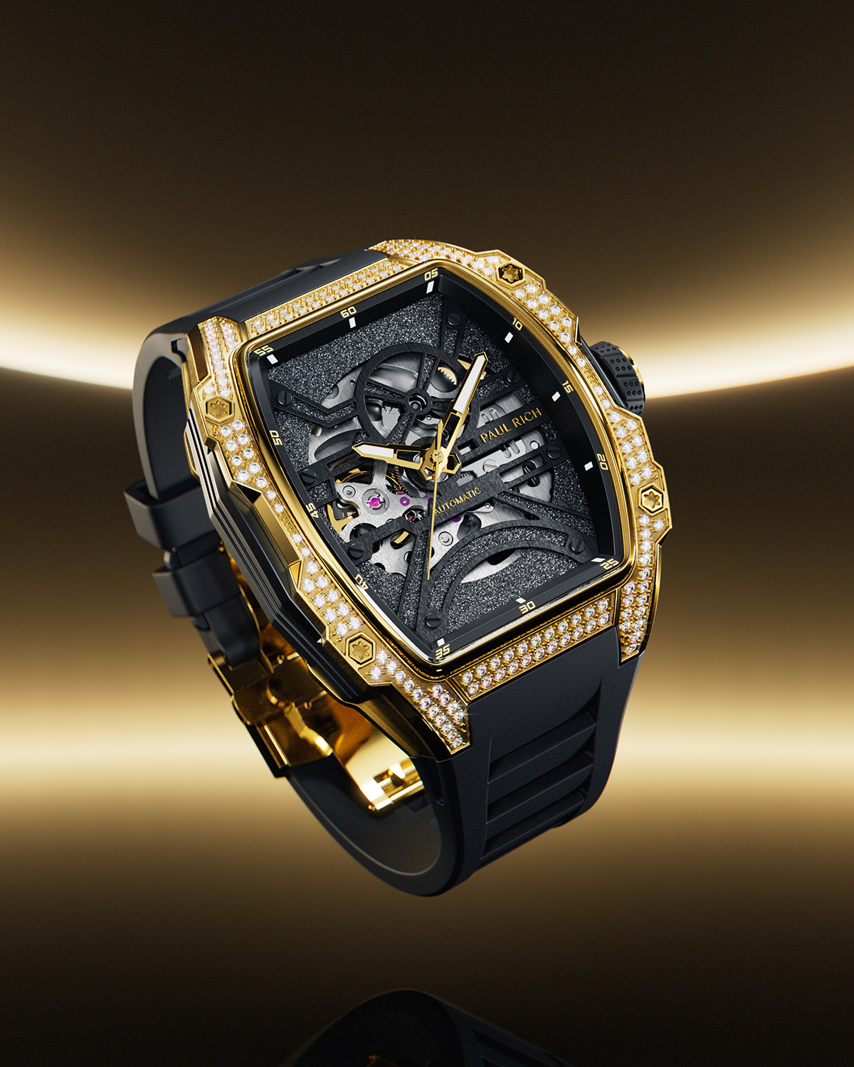 Angled view of a gold tonneau-shaped wristwatch with skeleton dial, crystal-set bezel, black textured baseplate, and black rubber strap on a transparent background.