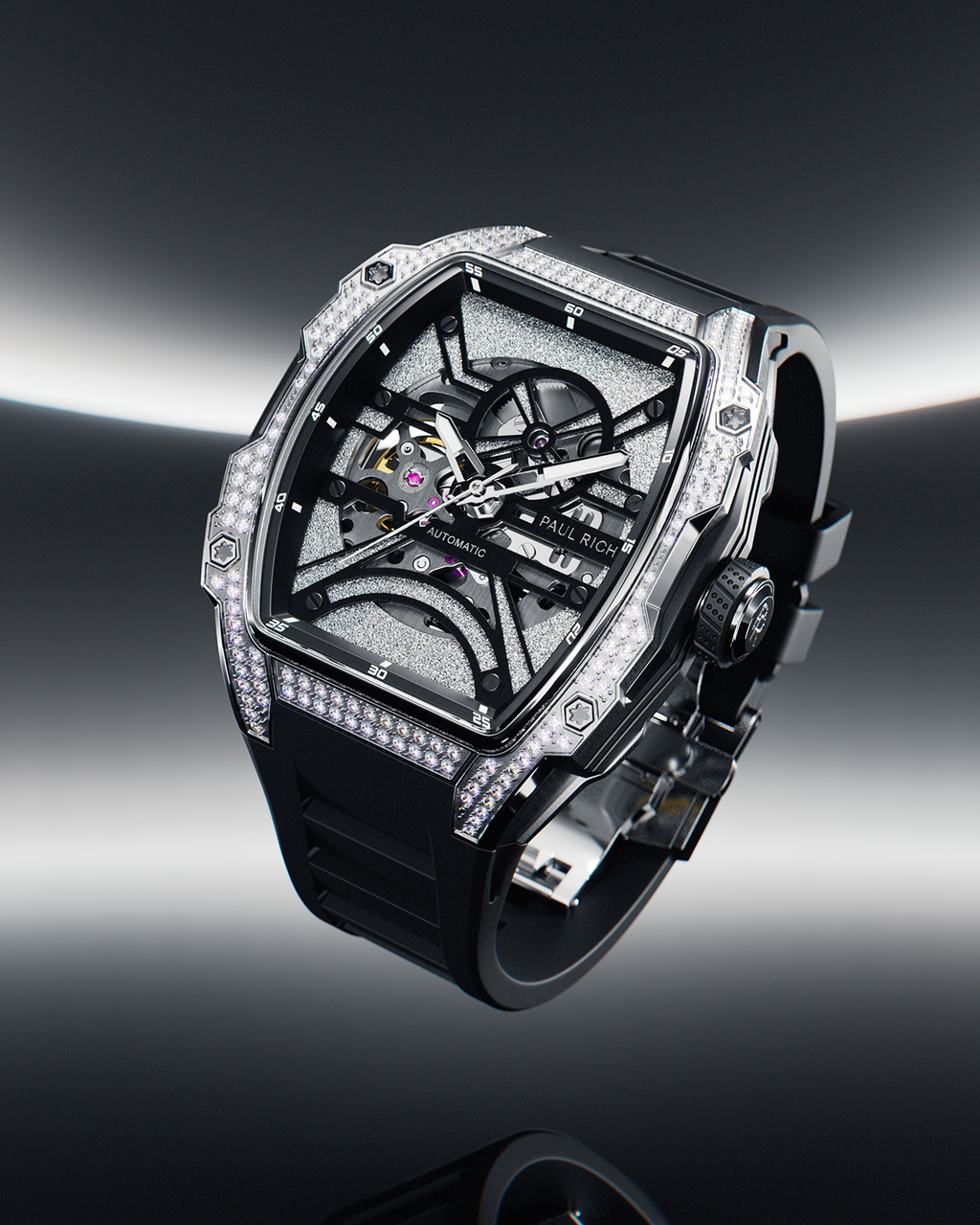 Tonneau-shaped wristwatch with skeleton dial, crystal-set bezel, and black rubber strap displayed on a reflective surface with a dark gradient background.