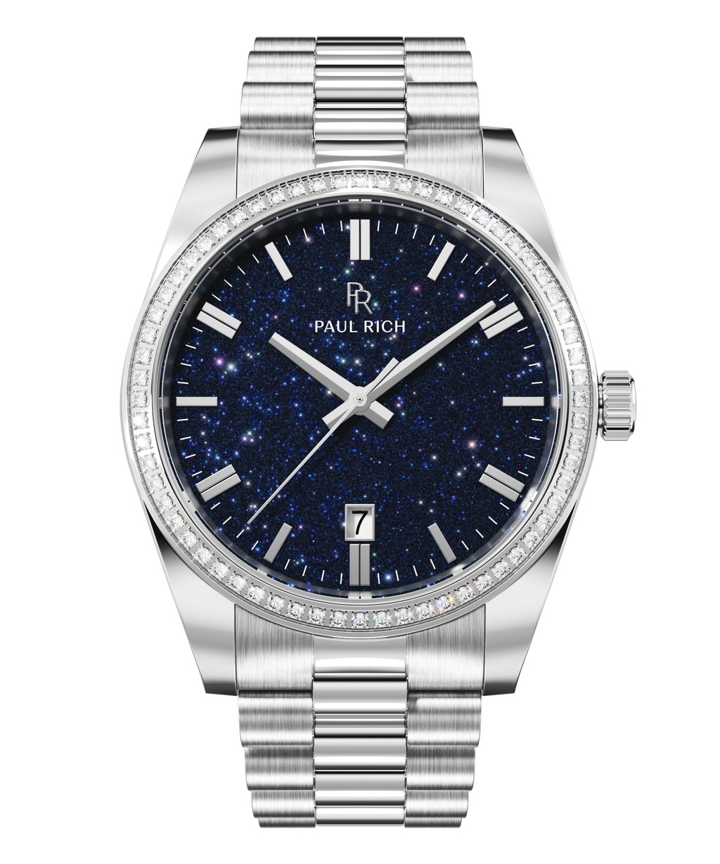 Silver watch with a blue aventurine dial, silver hour markers, date window at 6 o’clock, and crystal-set bezel.