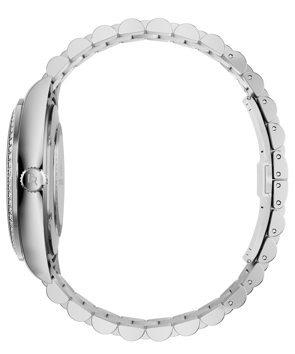Side view of a silver Paul Rich watch showing the crown with engraved logo, slim case profile, and full stainless steel bracelet.